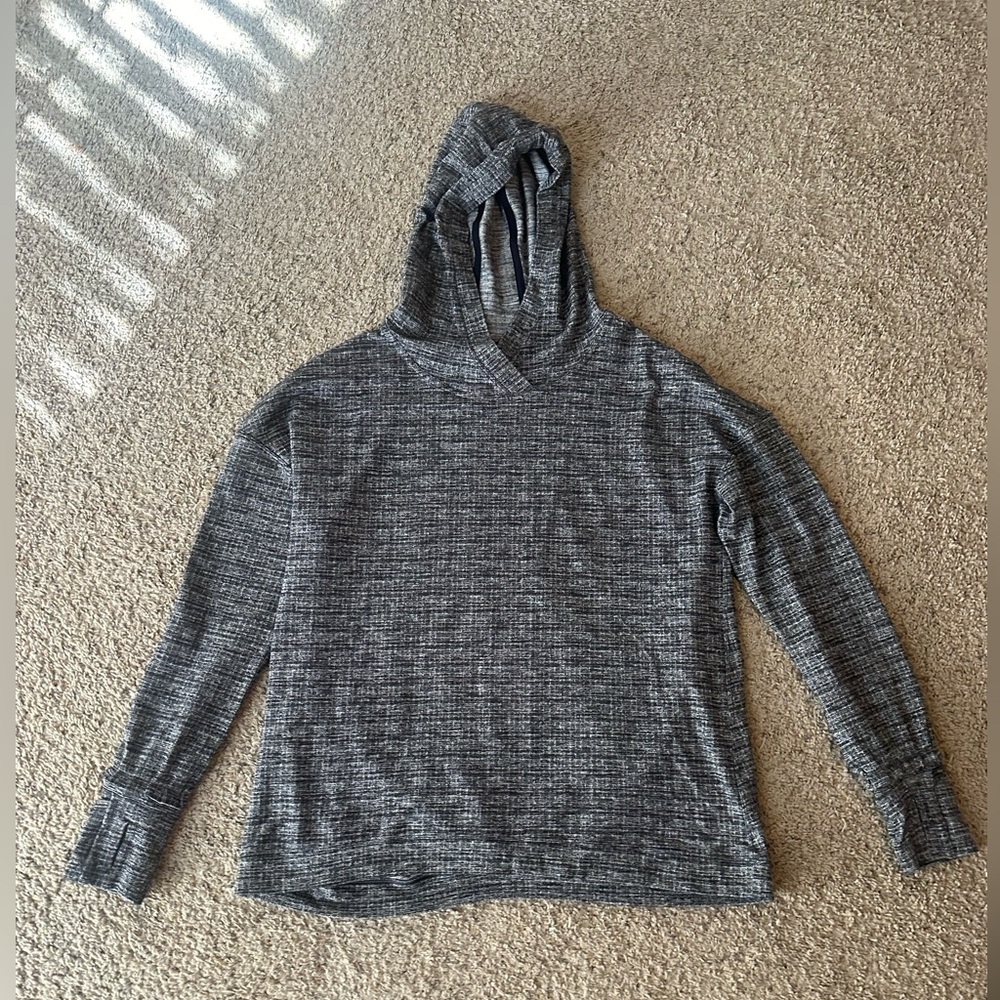 Lululemon pullover with hood, ruffles sleeves, pleated back.